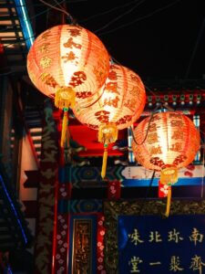 three orange hanging lanterns
