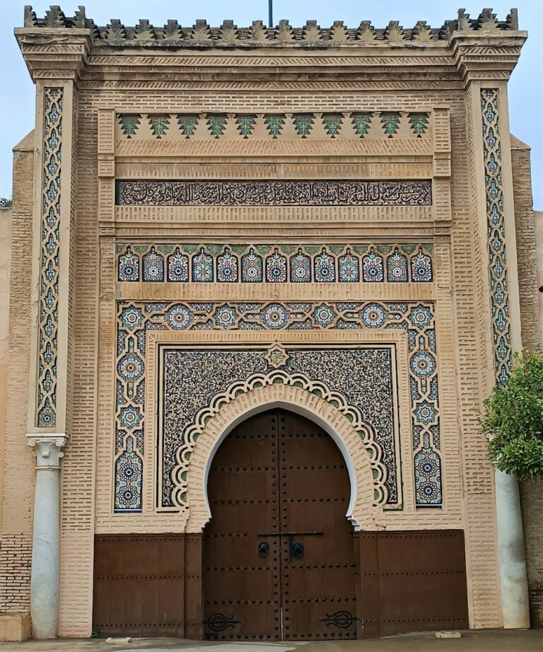 a tall building with a large wooden door