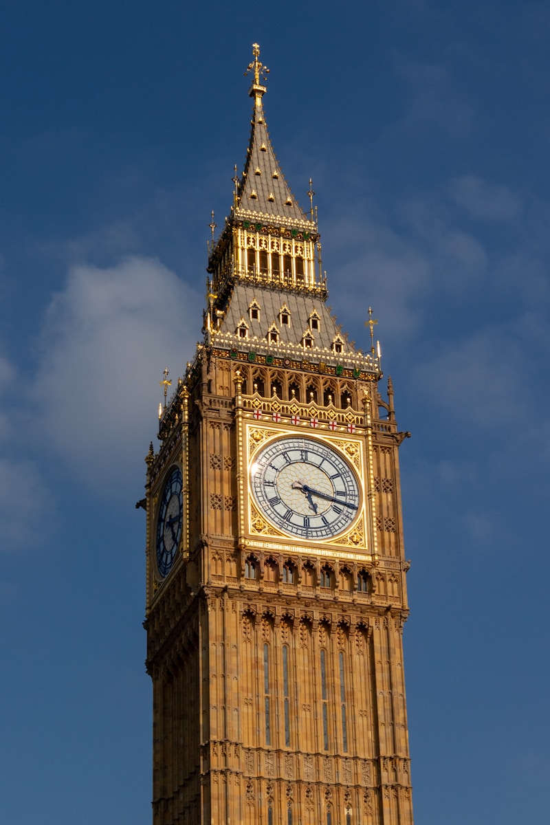 A tall clock tower with a sky background